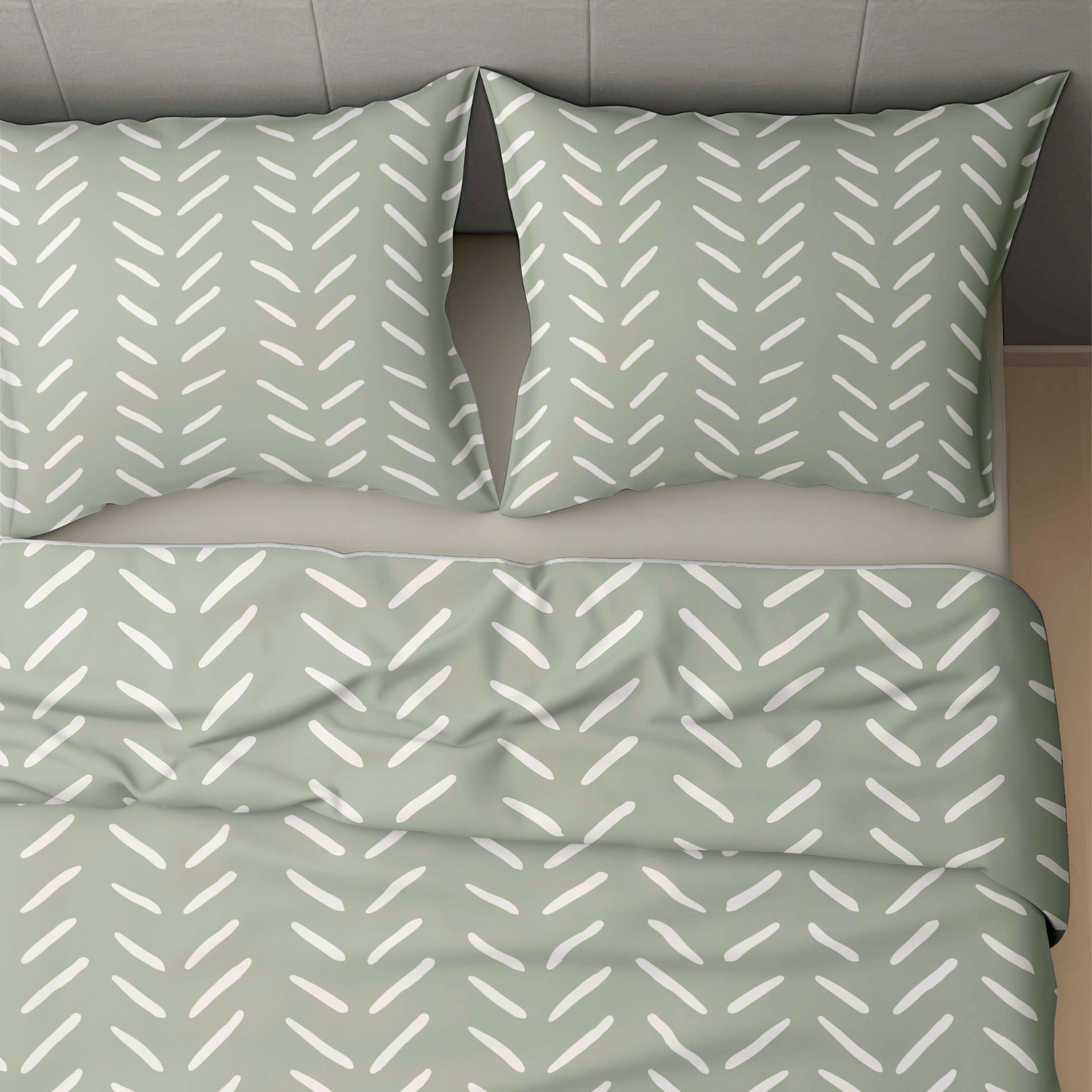 Un lit fait de deux oreillers et d'une housse de couette vert pâle avec des motifs blancs en forme de flèche met en valeur le lit Zelesta Wonderbed 4 Saisons Double - Coutures Olive, parfait pour le confort et le style tout au long de l'année.