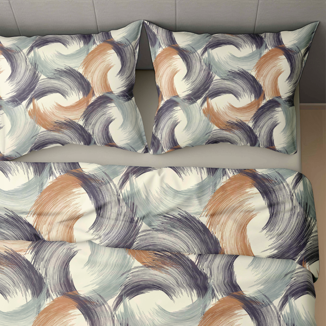 Lit avec deux oreillers et une couette Zelesta Wonderbed 4 Saisons Double - Traits Urbains, avec un motif tourbillonnant d'inspiration urbaine dans des tons bleus, bruns et gris sur un fond clair.